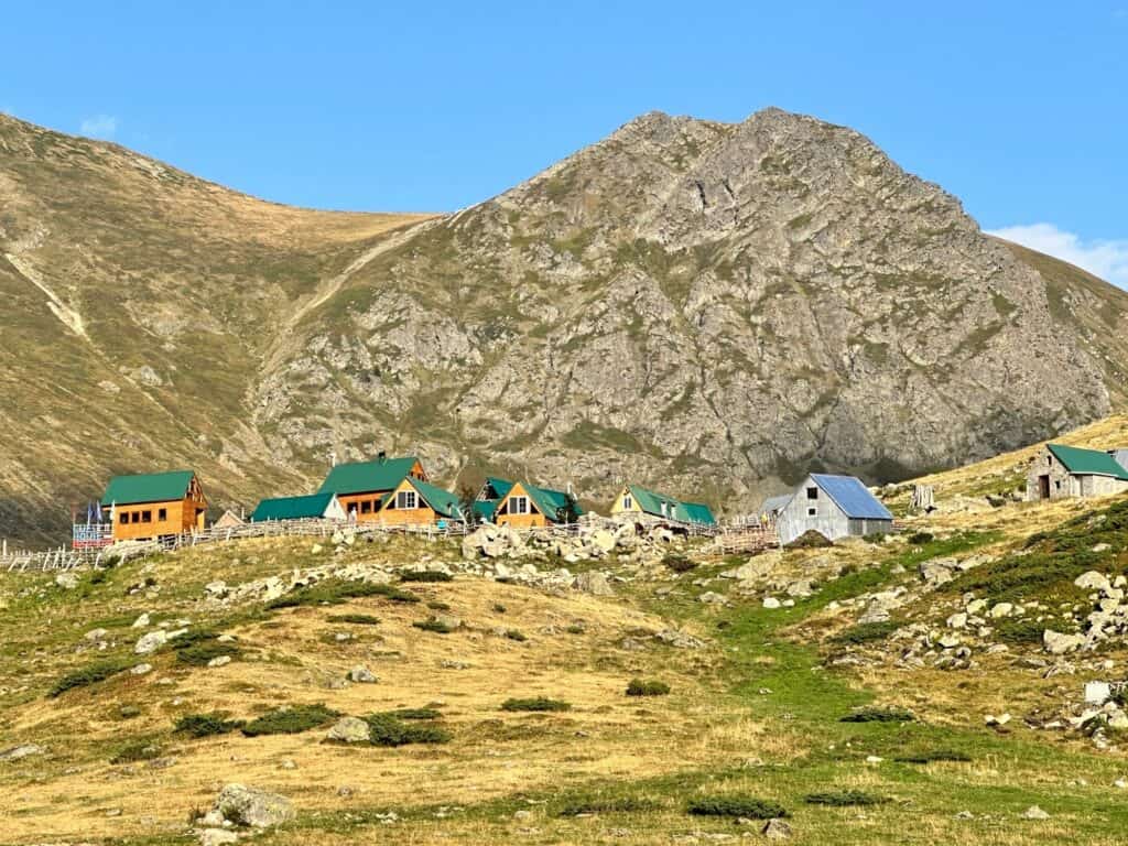 The remote village of Doberdol, Albania. High Mountains with stone houses nestled in the valley The remote village of Dobërdoll, Albania  - The start of our House Sitting Travel Planning!